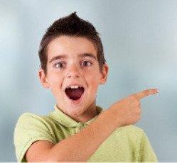 young boy excitedly pointing to the right