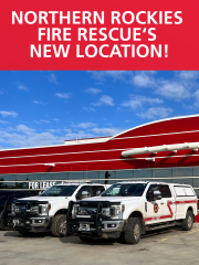 Poster of Northern Rockies Fire Rescue new location with fire trucks in the foreground. 